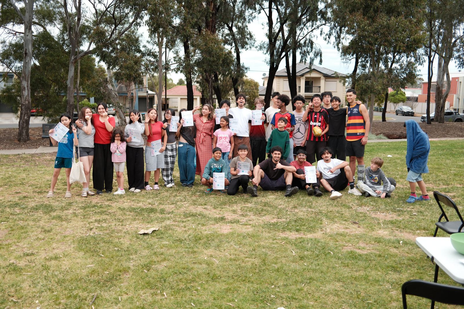 The whole junior youth group at the reserve holding up their certificates
