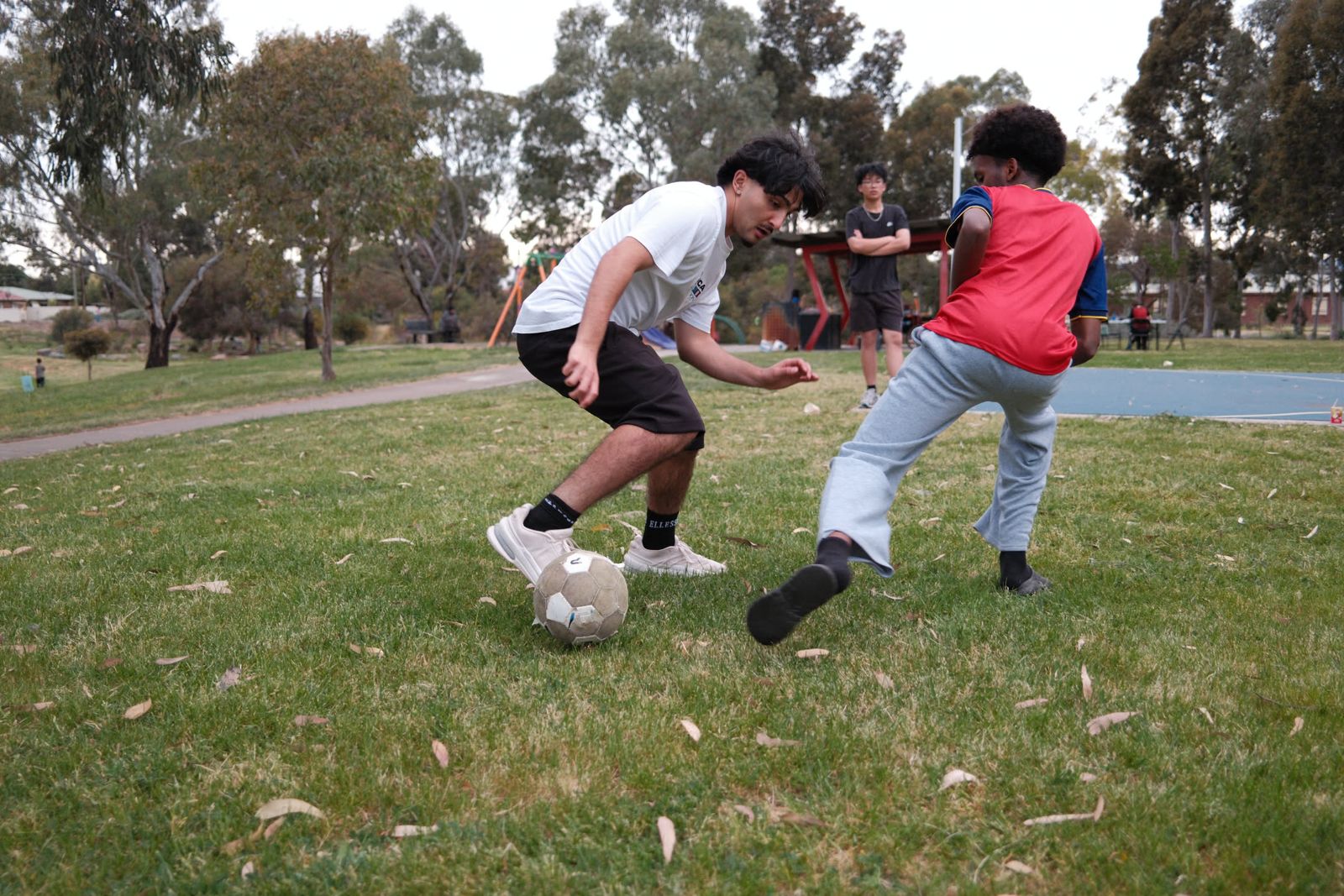 A game of soccer on the oval